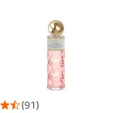 Frasco de perfume rosa con tapa dorada. "Ironie by Saphir" indica su equivalencia.